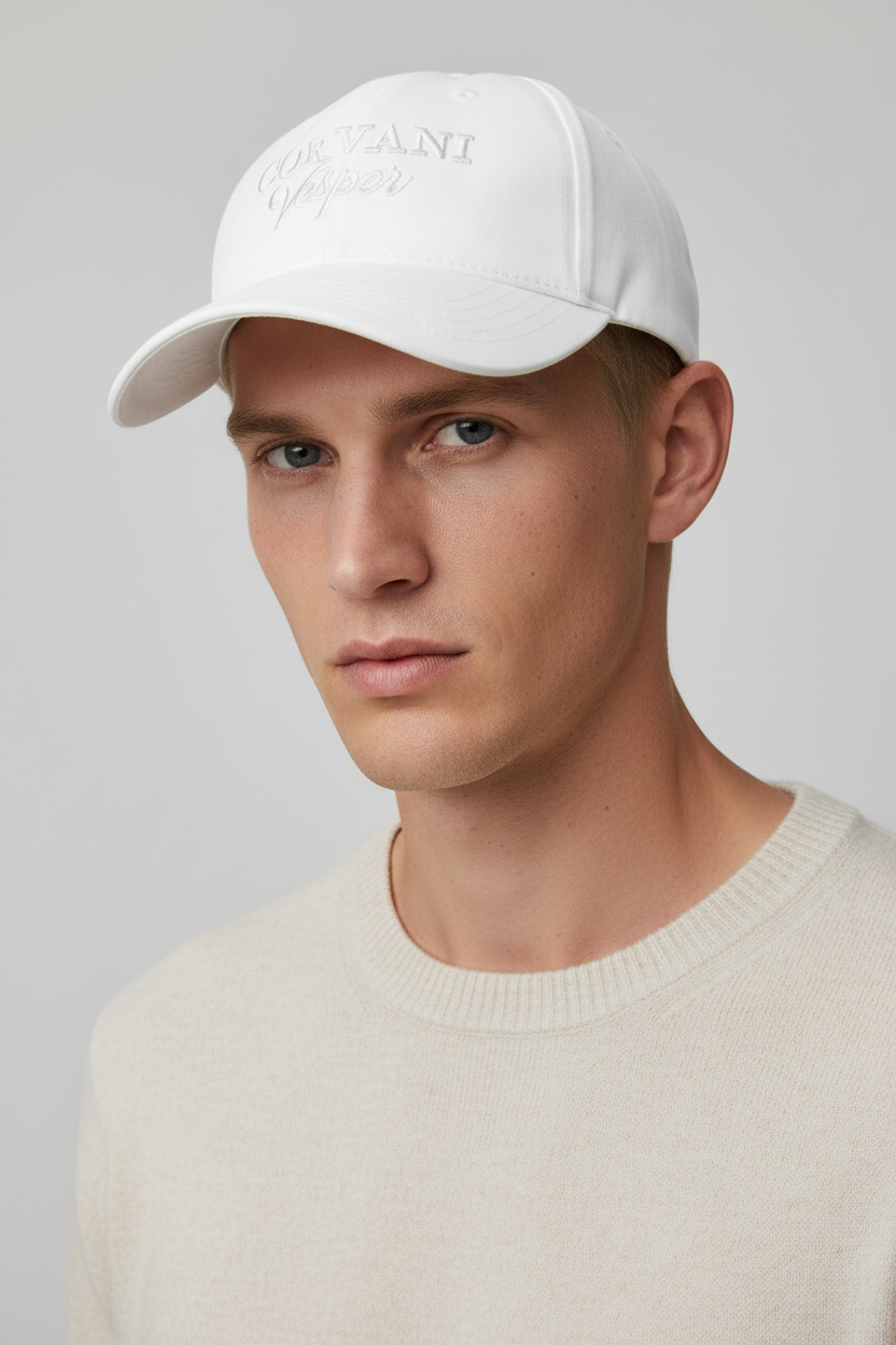 White Corvani Vesper Signature Cap by Exclusive, casual face cap with adjustable strap and subtle branding details.