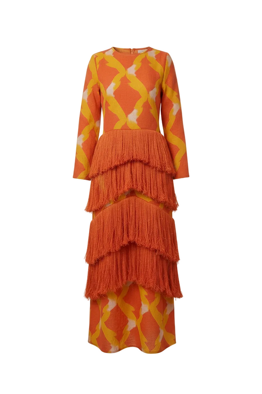 CORVANI VESPER ÀṢÀ layered fringe long dress with flowing fabric and intricate fringe details, styled for elegant occasions.
